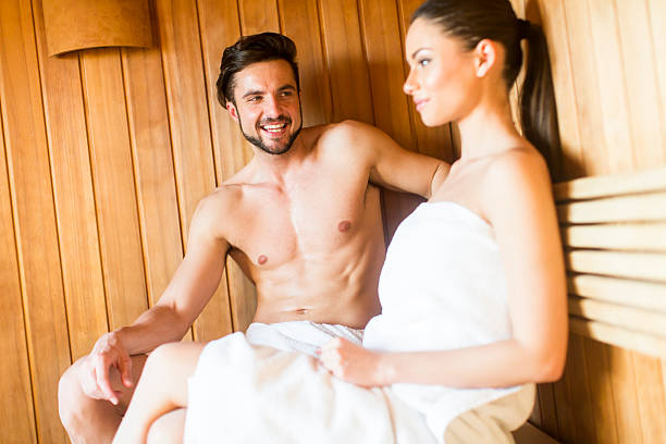 istock Young couple relaxing in the sauna 543450892