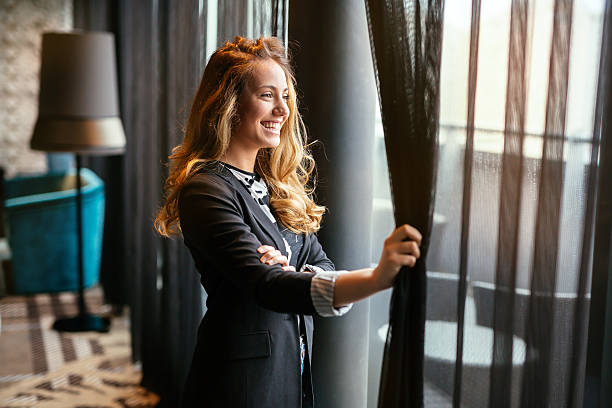 istock Glamorous woman  staring through window 543452346