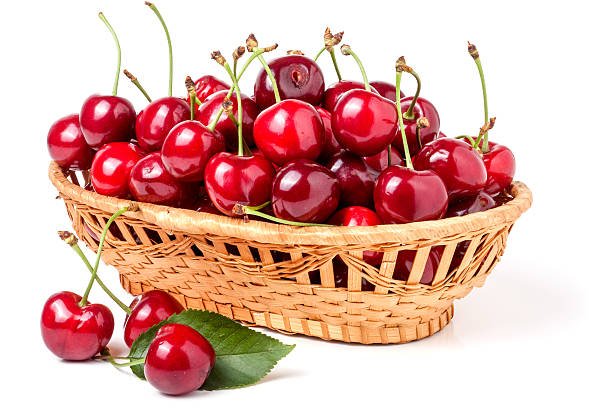 istock cherries in a wicker basket isolated on white background 543452484