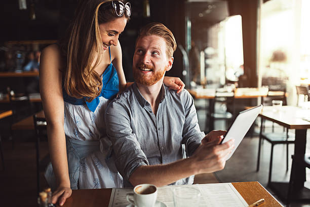 istock Beautiful couple looking at tablet 543452968