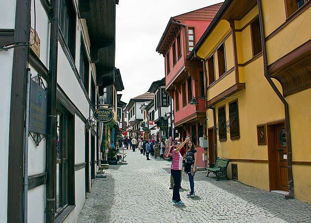 Eskisehir, Turkey - May 21, 2016: People walk on a street in Eskisehir. Eskisehir is a city in northwestern Turkey. It has the population of 631,905. There are lots of old ottoman Turkish Houses in Eskisehir, Turkey.