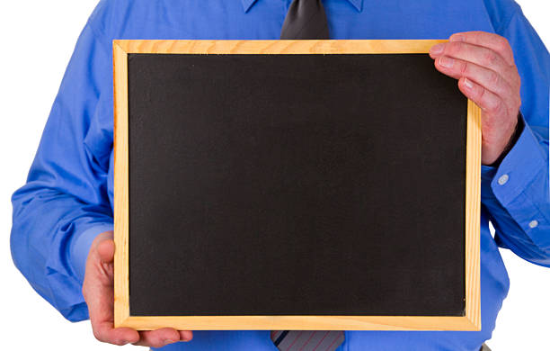 istock Businessman holding a blank Blackboard 543454424