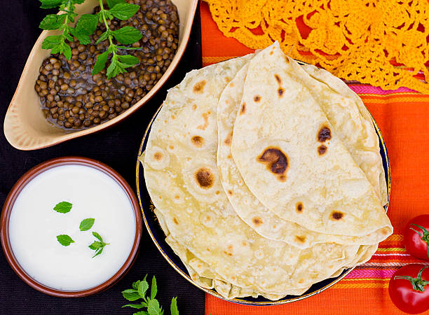 Indian flatbread chapati or roti Indian unleavened flatbread chapati or roti shrak stock pictures, royalty-free photos & images