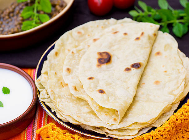 Indian flatbread chapati or roti Indian unleavened flatbread chapati or roti shrak stock pictures, royalty-free photos & images