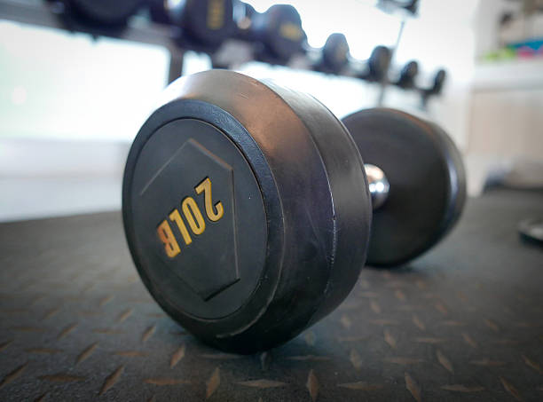 istock dumbbell onthe ground in gym 543456374