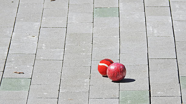 istock Two red balls on sunny road 543460436