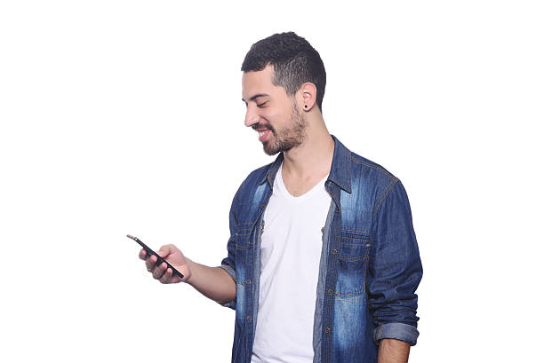 istock Young latin man typing on his smartphone. 543461392