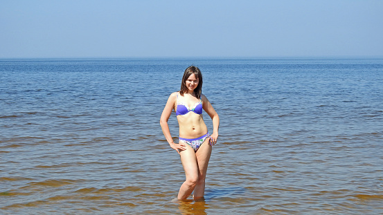 Young smiling woman on Baltic Sea. Summer 2016.