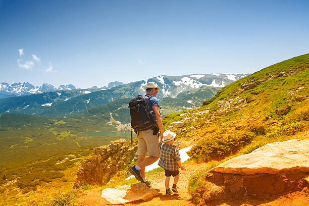 istock Father and his son hiking in mountains, Bulgaria 543467870