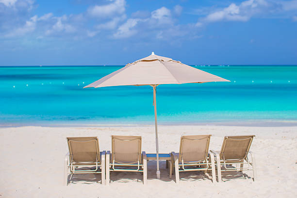 istock Beach chairs on exotic tropical white sandy beach 543468164