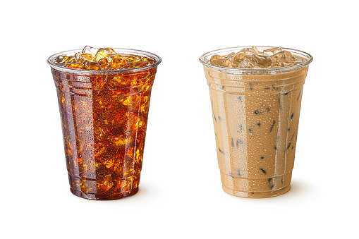 High resolution digital capture of two glasses of iced coffee, one with milk, and one without. Both coffees are in standard, restaurant-style, plastic cups that are ready for you to add your logo, and both are shot in an aspirational advertising style. Sharply focused, and isolated on a pure white background.