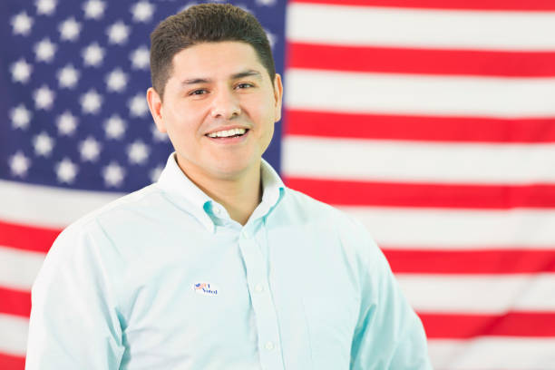 istock Hispanic Man in front of American flag 543471142