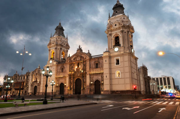 Cathedral of Lima The Basilica Cathedral of Lima is a Roman Catholic cathedral located in the Plaza Mayor of downtown Lima, Peru. Construction began in 1535, It is dedicated to St John, Apostle and Evangelist It retains its colonial structure and facade. There is Francisco Pizarro's tomb. peru city stock pictures, royalty-free photos & images