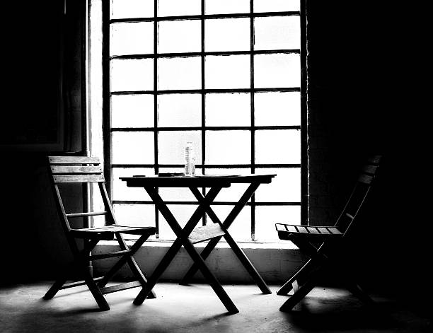 istock Black and white image of  chairs and table 543473714