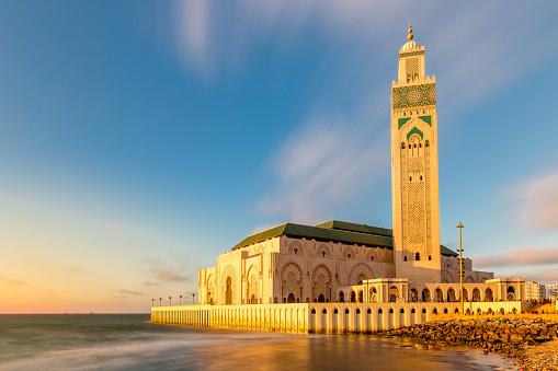 Long exposure of the sunsetting over the Hassan II Mosque, the third largest mosque in the world, in Casablanca, Morocco.