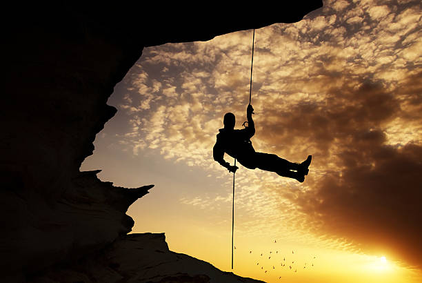 istock Silhouette of rock climber 543475942