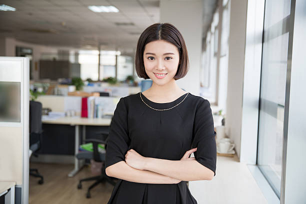 beautiful young girl chairman young beautiful girl, sitting in the office began her work civil servant stock pictures, royalty-free photos & images
