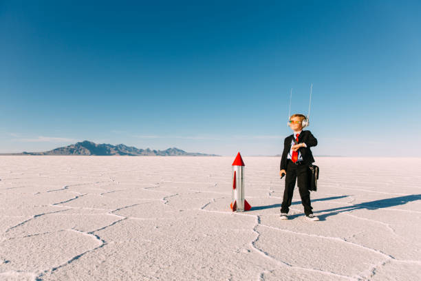istock Young Boy Businessman With Rocket 543481354