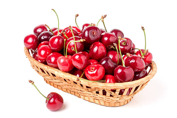 istock cherries in a wicker basket isolated on white background 543484194