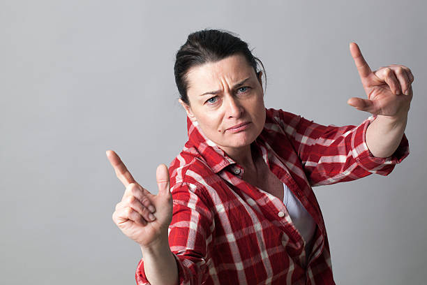 istock female rapper showing an aggressive hand gesture for arrogant attitude 543485286