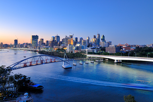 Brisbane CBD skyline with view of Brisbane river and Goodwill bridge at dusk