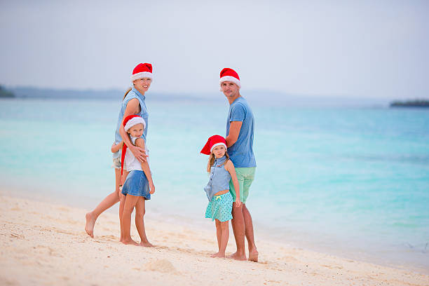 istock Happy family on white beach during summer vacation 543554402