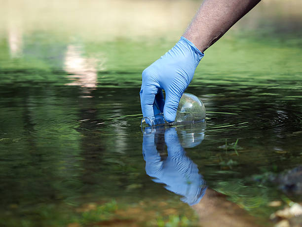 istock Hand in glove collects water to explore 543554506