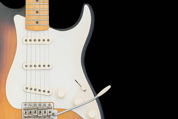 istock Brown, orange electric guitar isolated on black background. 543555894