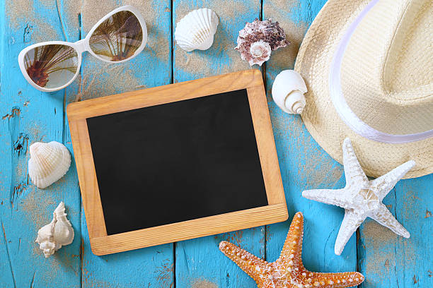 istock Top view of blank blackboard and beach accessories 543557052