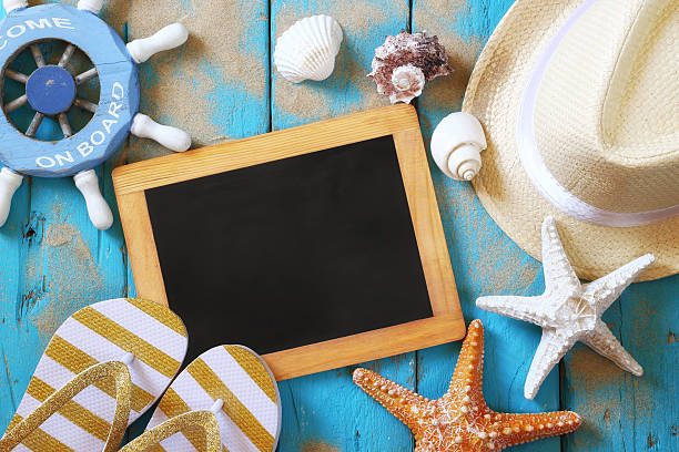 istock Top view of blank blackboard and beach accessories 543557274