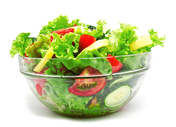 istock Fresh vegetable salad isolated on a white 543557334