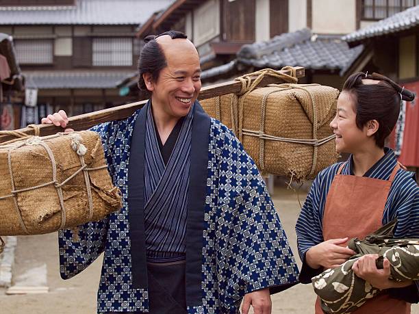 istock Japanese merchant and his assistant in Edo Period 543560124