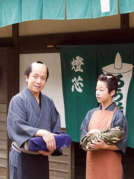 istock Japanese merchant and his assistant in Edo Period 543560214