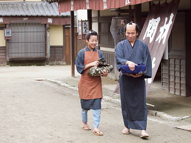 istock Japanese merchant and his assistant in Edo Period 543560568