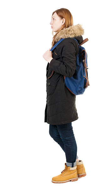 istock Back view woman in winter jacket with  backpack 543562166