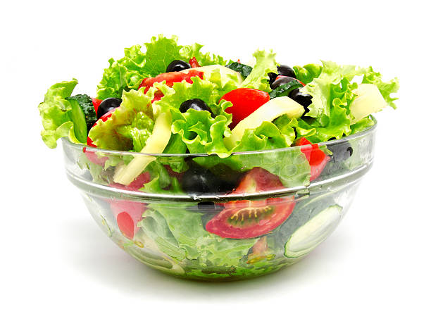 istock Fresh vegetable salad isolated on a white 543563196