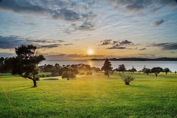 Sunrise over Waitangi Treaty Grounds, New Zealand The dawn moment is spectacular to witness over the vastness of the Bay of Islands Love the golden hour colors at sunrise ... bay of islands new zealand stock pictures, royalty-free photos & images