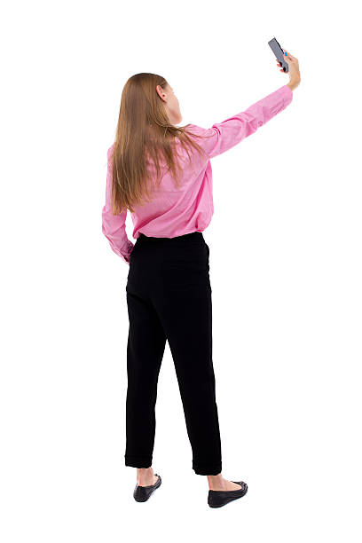istock back view of standing young beautiful  woman 543563556