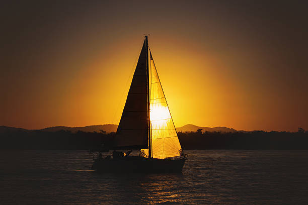 istock Sailing yacht against sunset 543563648