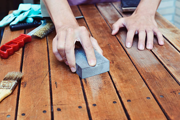 istock young man sanding a wooden table with a sanding block 543563760
