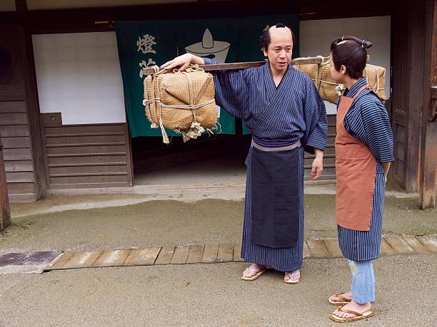 Japanese merchant teaches  his assistant in Edo Period
