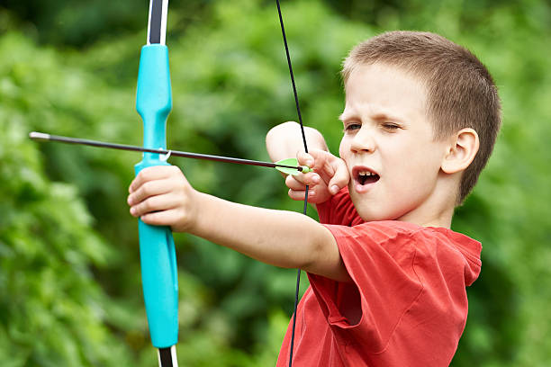 istock Little boy archer with bow and arrow 543565176