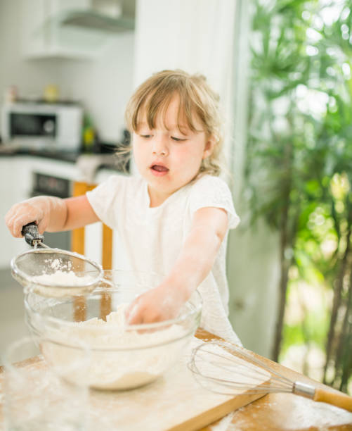 istock Little girl is cooking in the kitchen 543567176