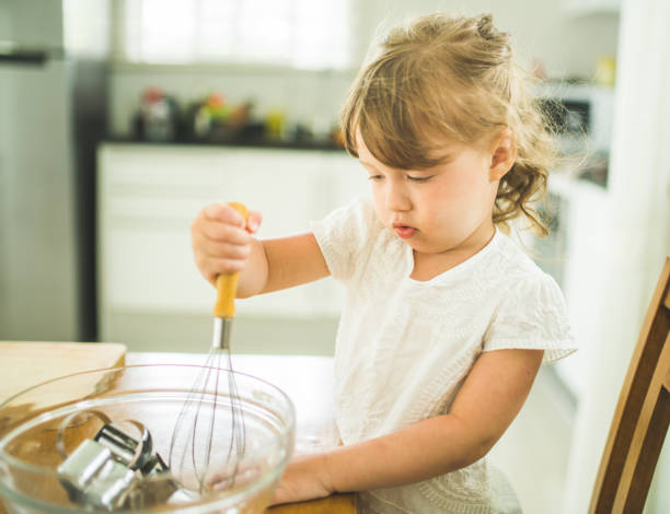 istock Little girl is cooking in the kitchen 543567270