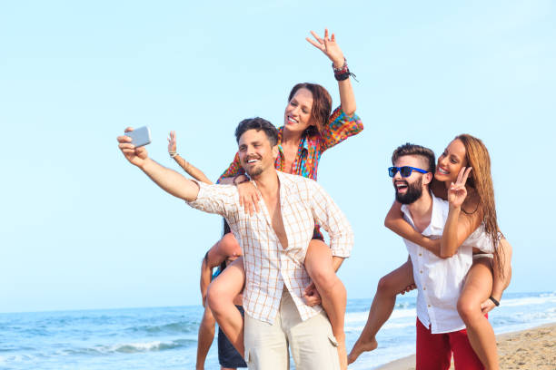 istock Group of young people having fun on the beach 543567510