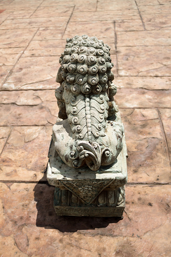 A lion statue symbolizes to the protector in front of the entry way.