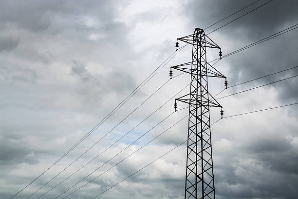 istock Silhouette of a power cable tower on cloudy day 543570186