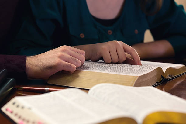 istock Young Couple Studying The Bible 543571990