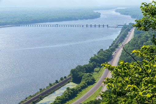 A scenic view of the Mississippi River with a lock and dam.