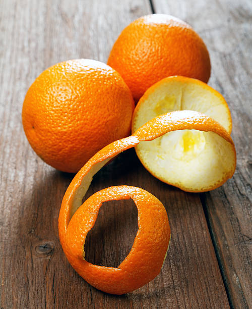 istock Oranges and dried peel on a rural table 543573864
